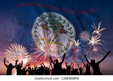 Happy people are looking holiday fireworks with flag of Belize in sky, independence day - Powered by Shutterstock