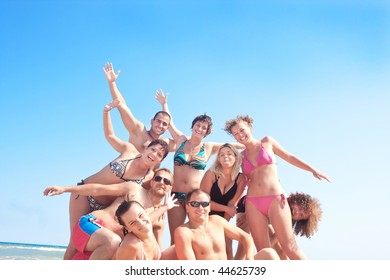 Happy people on the beach having fun