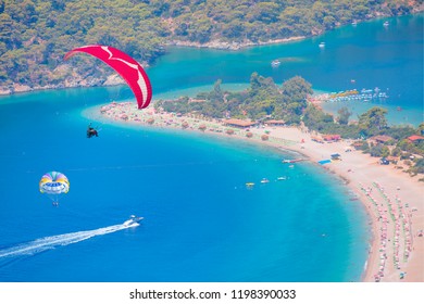 Happy People Parasailing On Oludeniz Beach In Summer - Oludeniz Beach And Blue Lagoon, Best Beaches In Fethiye, Turkey 