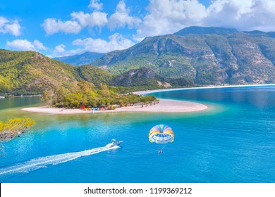 Happy People Parasailing On Oludeniz Beach In Summer - Fethiye, Turkey