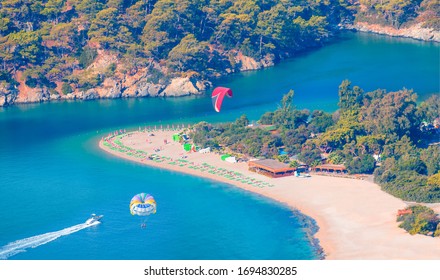 Happy People Parasailing On Oludeniz Beach In Summer - Fethiye, Turkey