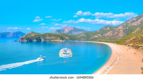 Happy People Parasailing On Oludeniz Beach In Summer - Fethiye, Turkey