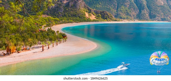 Happy People Parasailing On Oludeniz Beach In Summer - Fethiye, Turkey