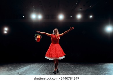 

Happy Performer Greeting the Audience Receiving Flowers. Talented actress getting standing ovations for her performance 
 - Powered by Shutterstock