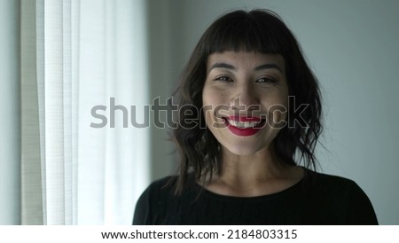 Happy person with Native American traits smiling. Portrait of young South American young woman of Indigenous descent