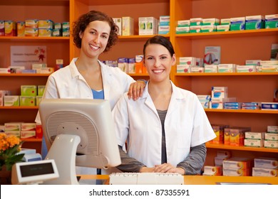 Happy Pharmacist And A Pharmacy Technician In A Drugstore