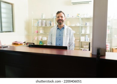 Happy Pharmacist Smiling Making Eye Contact While Working At The Pharmacy Of A Retirement Home 