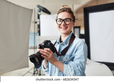 Happy Photographer In Modern Photo-studio