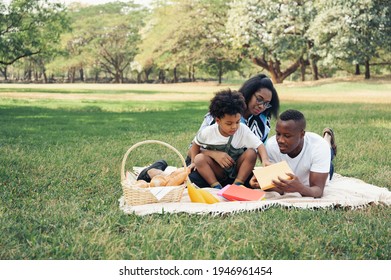 Happy Picnic Relax Black People Family And Son In Garden With Bread In Basket