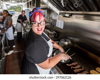 Happy Pink Haired Chef Grills Bacon On A Food Truck