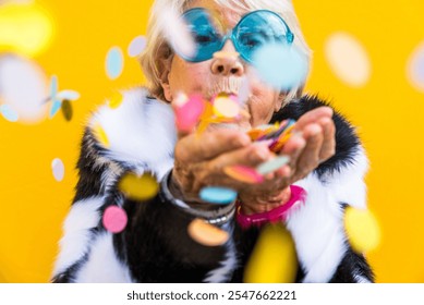 Happy and playful senior woman having fun - Portrait of a beautiful lady above 70 years old with stylish clothes, concepts about senior people - Powered by Shutterstock