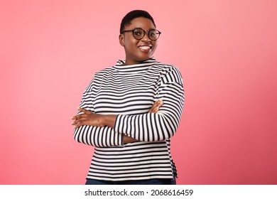Happy Plus Size Black Woman Wearing Eyeglasses Smiling To Camera Standing Over Pink Background. Cheerful Millennial Female In Eyewear Posing In Studio - Shutterstock ID 2068616459