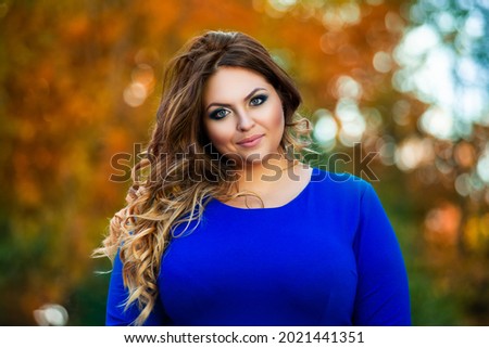 Similar – Image, Stock Photo Long-haired curly woman plus size in a wreath of red poppies stands among a field of meadow flowers and covers her face with a bouquet of poppies