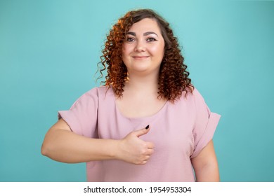 Happy Plus Size Woman. Like Gesture. Healthy Lifestyle. Body Positive. Conceptual Portrait. Smiling Fatty Lady Holding Thumb Up Supportive Sign Looking At Camera Isolated Blue.