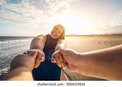 Happy plus size women having fun on tropical beach during summer vacation - Overweight confident people concept
