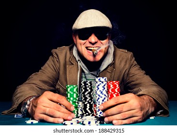 Happy poker face on the man.selective focus on the man head 