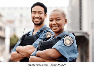 Happy police, team and arms crossed in confidence for city protection, law enforcement or crime. Portrait of man and woman officer standing ready for justice, security or teamwork in an urban town
