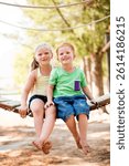 Happy, portrait and children in park for bonding, connection or adventure together. Love, siblings and kids embracing outdoor on playground for development, growth and exploring in nature with family