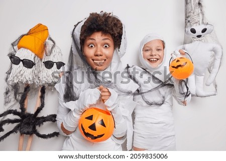 Similar – Foto Bild Happy Halloween.überrascht Kind in einem Skelett-Kostüm mit Popcorn gegen orange Hintergrund