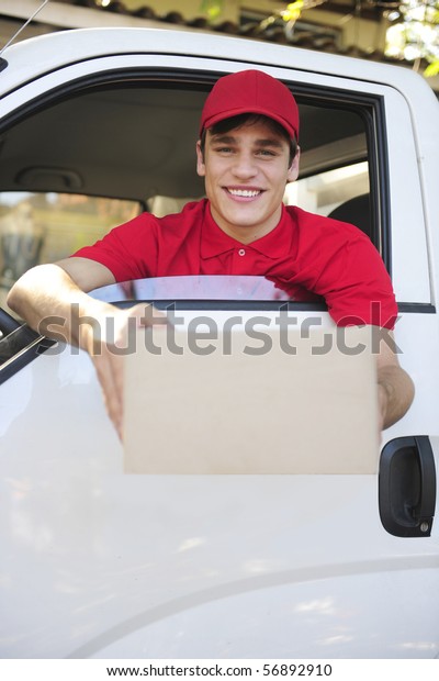 happy\
postal delivery courier in a van delivering\
package
