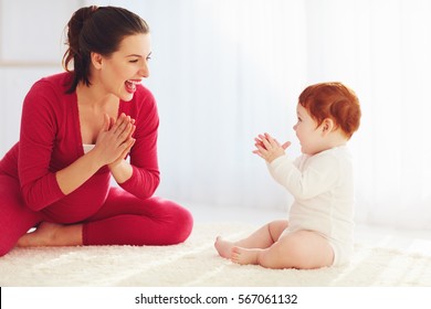 Happy Pregnant Mother And Toddler Baby Playing Games At Home, Clapping Hands Together