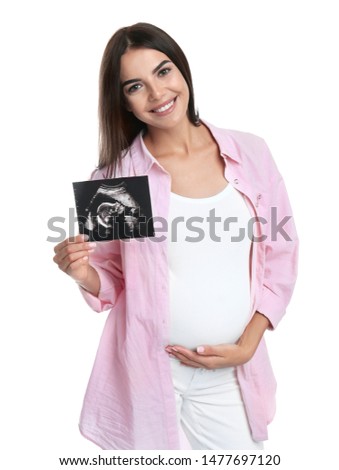 Happy pregnant woman with ultrasound picture on white background