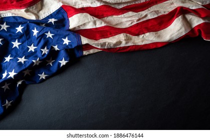 Happy presidents day concept with flag of the United States on black wooden background. - Shutterstock ID 1886476144
