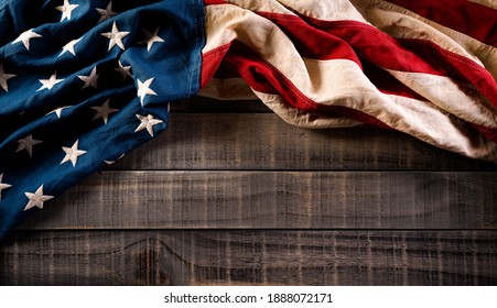 Happy presidents day concept with flag of the United States on old wooden background. - Shutterstock ID 1888072171