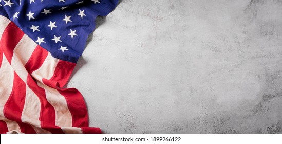 Happy presidents day concept with flag of the United States on old stone background.
