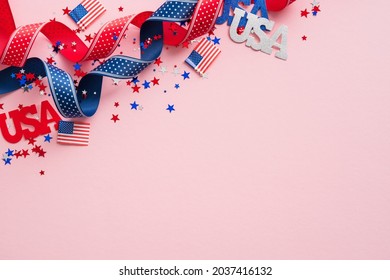 Happy Presidents Day Concept. Grosgrain Ribbon, American Flags And Confetti Stars On Pink Background With Copy Space. Web Banner Template For USA Independence Day Or Veterans Day