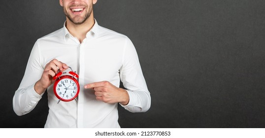 Happy Professional Man Crop View Pointing Finger At Alarm Clock Dark Background Copy Space, Countdown