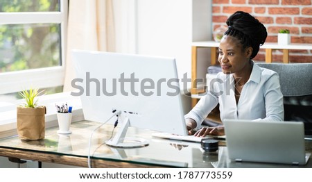 Happy Professional Woman Employee Using Computer For Work