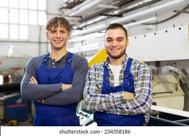 Happy Professional Workers In Uniform At Modern Industry Plant