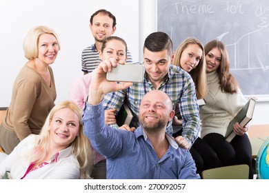 Happy professionals and coach making group portrait at the school  - Powered by Shutterstock