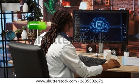 Happy programmer celebrating after successfully implementing code using artificial intelligence computing. Cheerful employee excited after finishing work on AI deep neural networks on PC, camera A