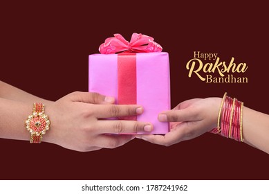 happy raksha bandhan (rakhi, rakshabandhan) concept. Indian brother giving gift to his sister - Shutterstock ID 1787241962