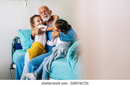 Happy recovering grandfather is visited by his grandchildren in the hospital. - Powered by Shutterstock