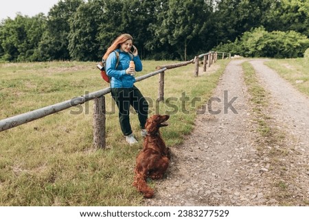 Similar – Image, Stock Photo Redheaded hiker with water bottle on nature getaway