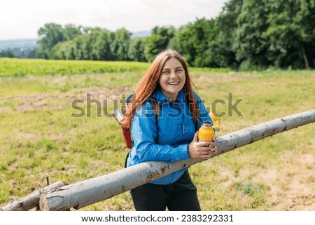 Image, Stock Photo Redheaded hiker with water bottle on nature getaway