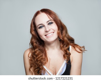 Happy redhead woman smiling, closeup portrait