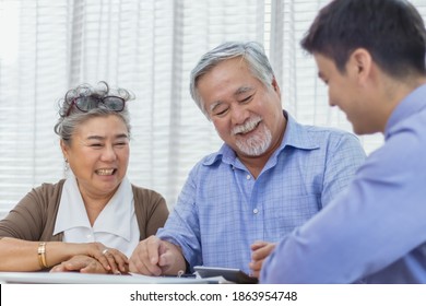 Happy Retired Asian Senior Eldery Couple Consult With Personal Financial Advisor Or Real Estate Agent. Retirement Investment Planning With Professional Counseling. Home Loan And Mortgage Concept