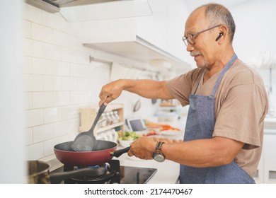 Happy Retired Asian Senior Man Cooking In Kitchen, Healthy Food. Healthy Lifestyle, Prepare Food, Dieting Concept