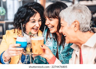 Happy retired friends having fun drinking cocktail at pre dinner party - Senior people women enjoying the happy hour of the weekend together - elderly people lifestyle concept - Powered by Shutterstock