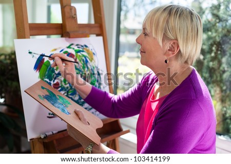 Similar – Image, Stock Photo Elderly woman painting in her art studio
