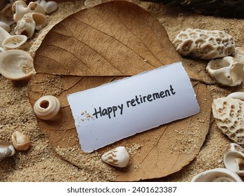 Happy retirement writing on beach sand background. - Powered by Shutterstock