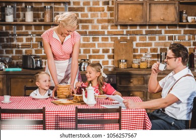 Happy Retro Styled Family Having Breakfast Together 