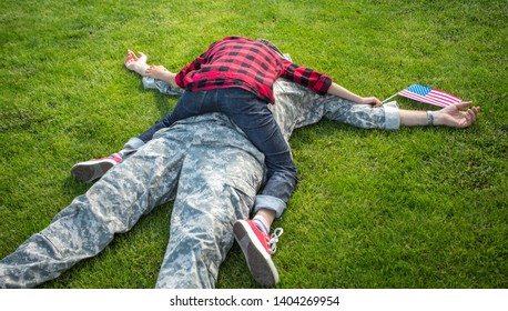 Happy Reunion Of Soldier With Family Outdoors. Father With His Son Hugging, Holiday, Homecoming, Emotions, Happiness