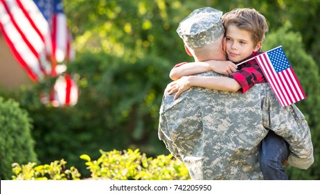 Happy Reunion Of Soldier With Family, Son Hug Father