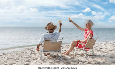 Happy romantic couple caucasian senior woman travel nature ocean relaxing and drink orange juice at tropical beach, Healthy seniors lifestyle, Savings and senior health insurance concept. - Powered by Shutterstock