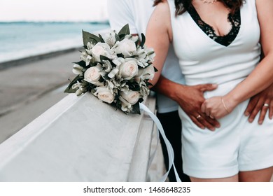 Happy romantic couple walking along the promenade. Honeymoon in Europe. - Powered by Shutterstock